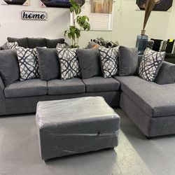 Grey Sectional With Designed Pillows 