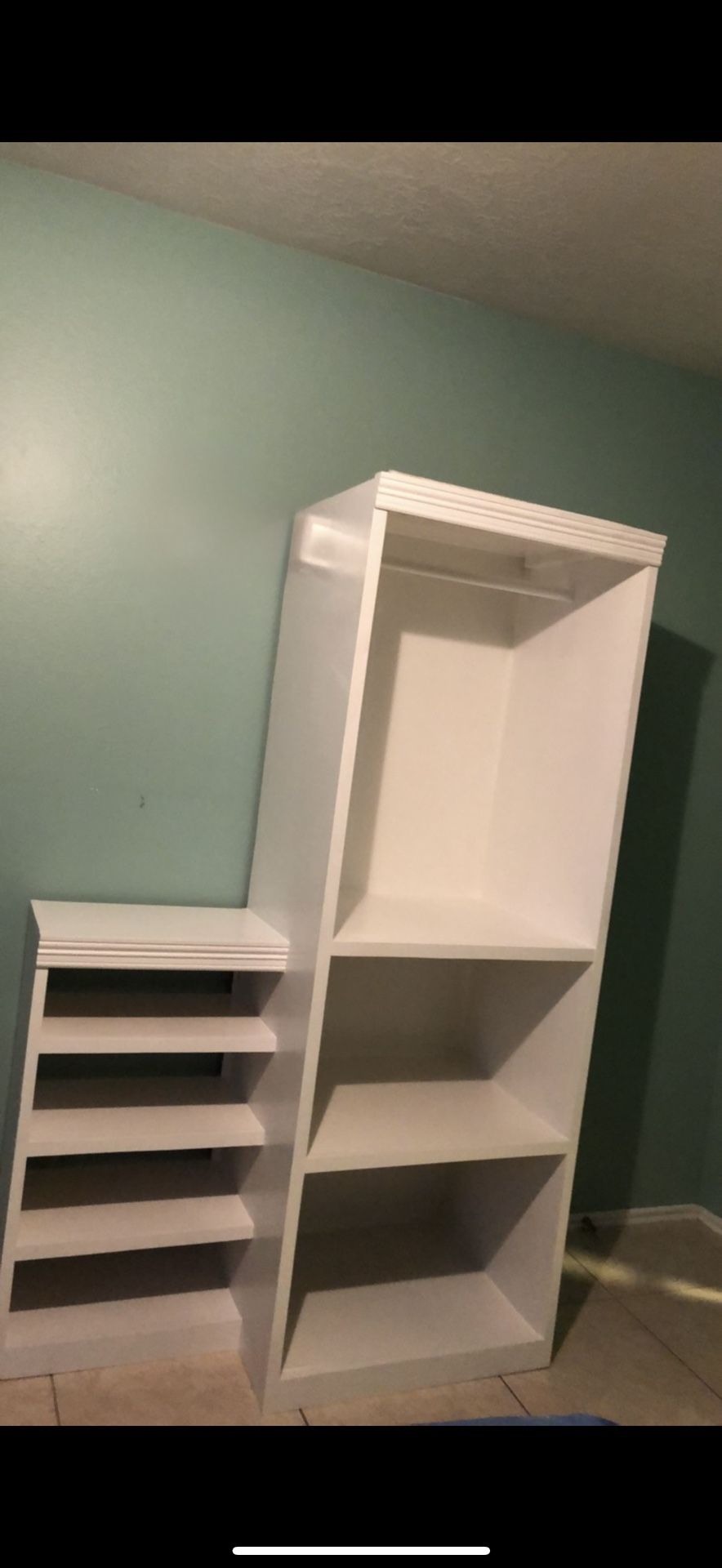 white shelving/display unit or cabinet with open cubbies):