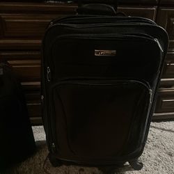 $40 OBO Four  Wheels Carry On Black Luggage 