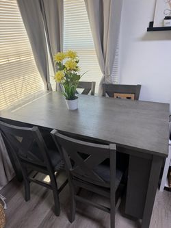Table with storage and 4 chairs