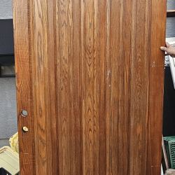 Varnished oak  door, 98 1/2 x 49 3/4 inches, with frame.    Puerta De Madera Oak Barnizada 