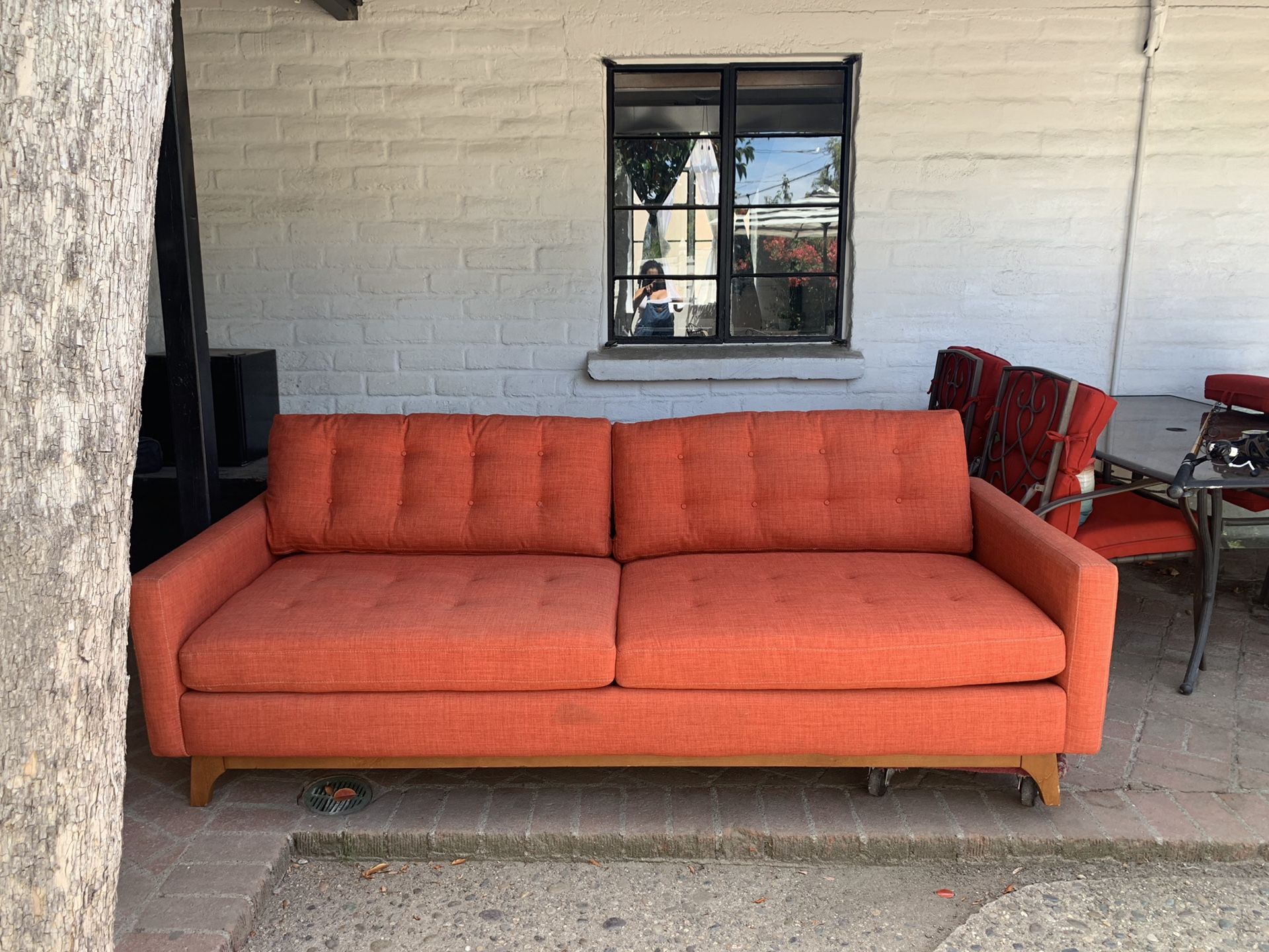 Orange/ coral sofa couch