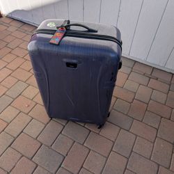 Tumi Extra Large Hardshell Luggage