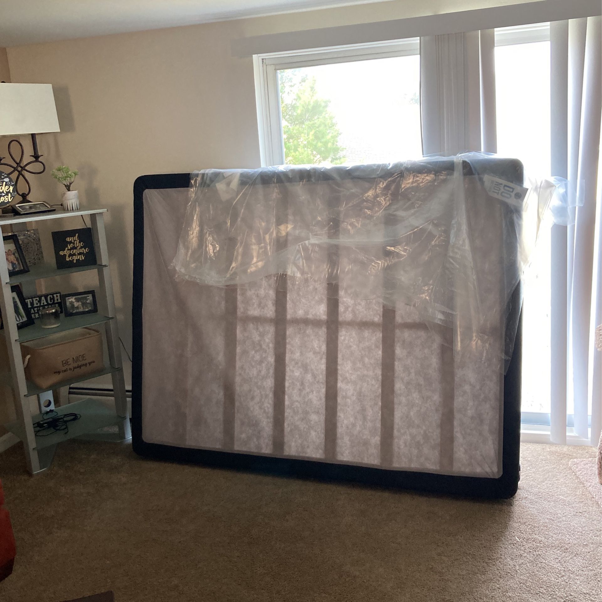 Queen Size Box Spring Never Used.  Has A Rip On The Bottom From Moving It 