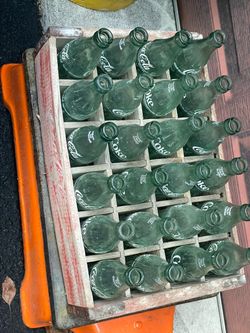 cola bottles, and crate Vintage Coca cola bottles, and crate