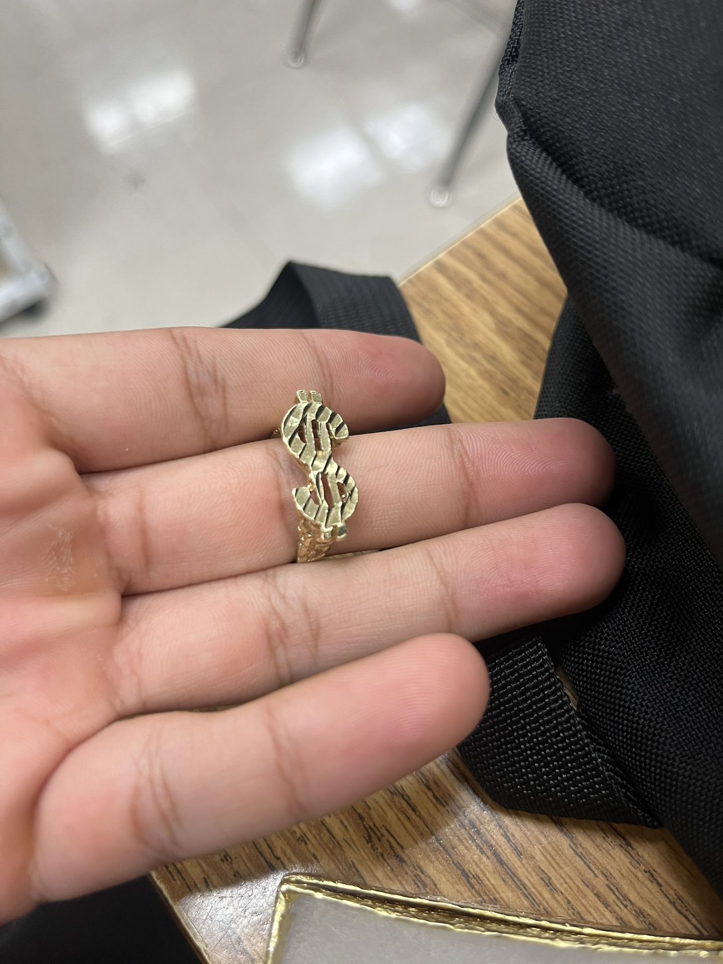 gold money sign ring