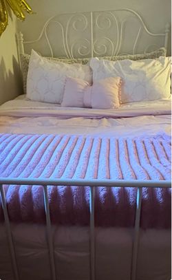 Full White metal bed frame with elegant scroll design headboard and footboard. Good used condition with normal wear.