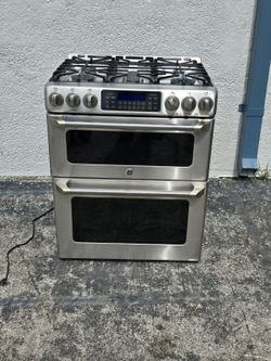general electric five stainless steel double oven gas stove.