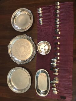 Assorted silver plate serving dishes and assorted silver plate flatware