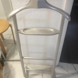 ROLLING VALET STAND. SILVER PAINTED WOOD CLOTHING DRESSER STAND