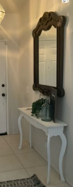 Mirror and small white table