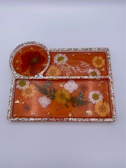 Orange resin tray with a skeleton sticker