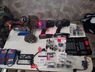 One Stick And One Pretty Much Fully Modified Traxxas Rustlers