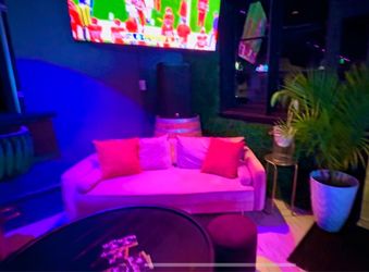Modern pink colored sofa, velvet