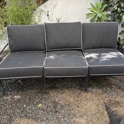 Outdoor wrought iron sofa with cushions 
