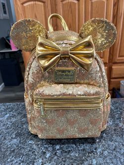 Disney Parks Loungefly Beautiful Backpack Gold color Sequins Sequin. The picture doesn’t show how beautiful this backpack is. Brand New With Tags .