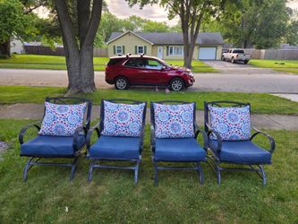 Set Of 4 wide rocker aluminum patio chairs with nice thick cushions