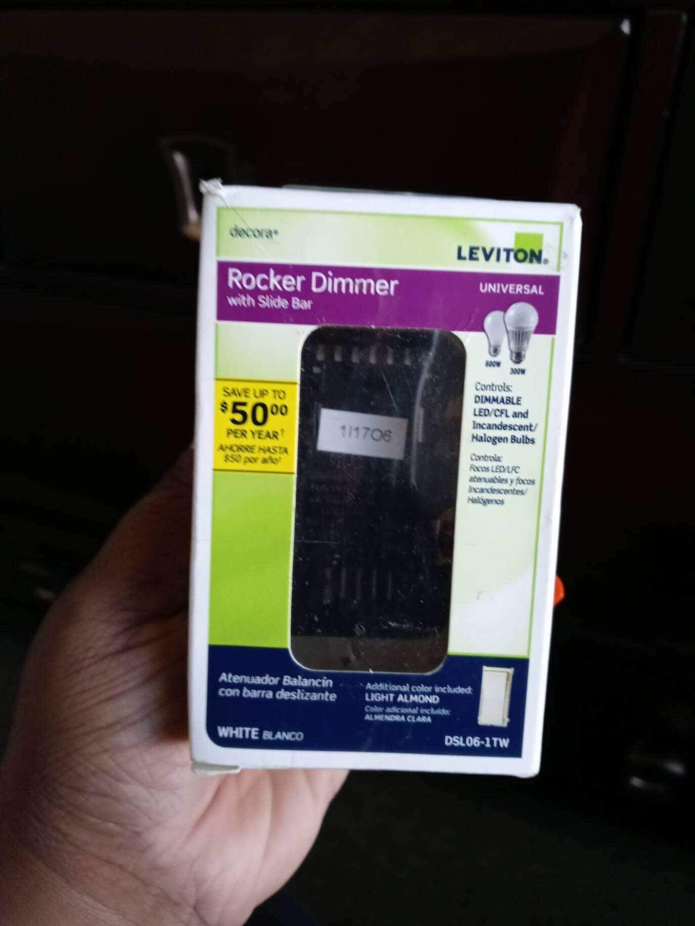 brand newrocker dimmer with slide bar in a green box