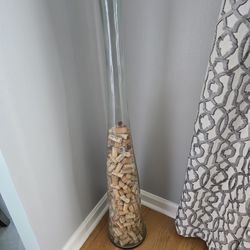 Tall glass jar with corks