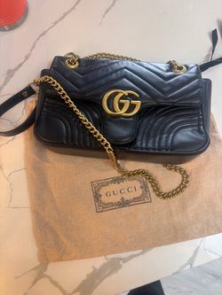 Gucci GG Marmont-style black matelassé bag with gold hardware