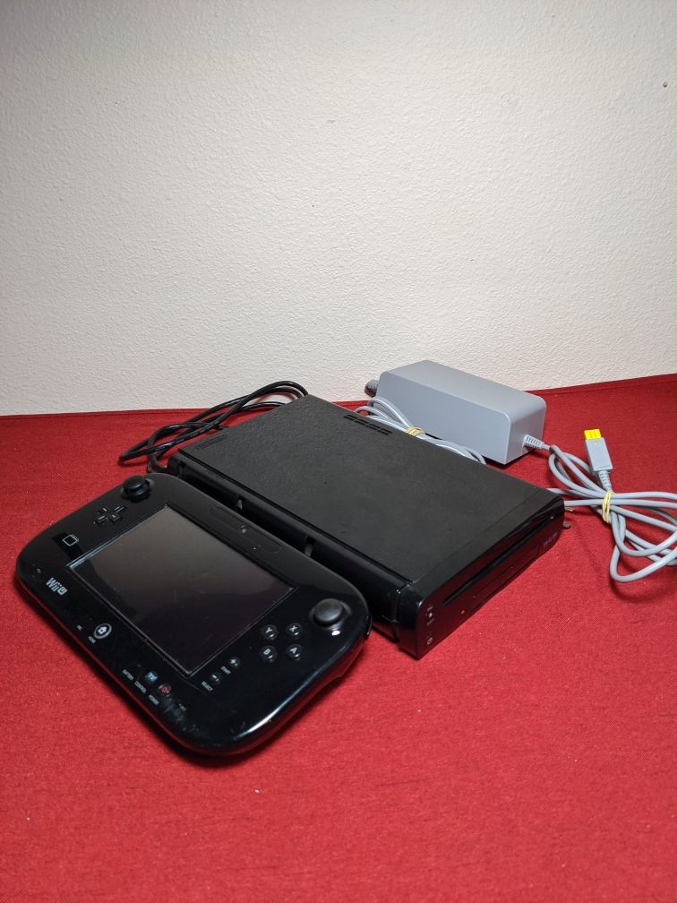 Black Nintendo Wii U deluxe with games installed