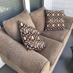 Tan Brown Loveseat With Pillows