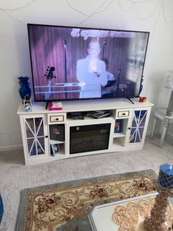 Fireplace entertainment center table