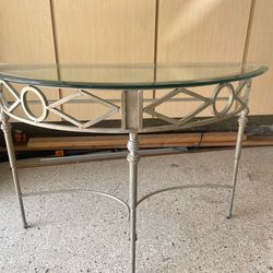 Glass topped metal table
