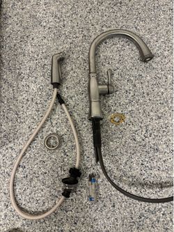Delta kitchen faucet – hose is cut, needs replacement. Sold as-is for parts or repair.