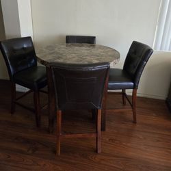 Pub height, faux marble table, 4 chairs 