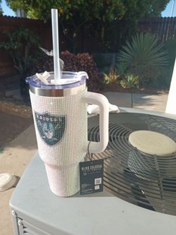 A bedazzled 40 6 oz raiders tumbler brand new with tag still attached original price 69