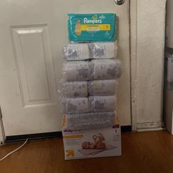 Over 200 New Born Diapers And A Box Of 1 Month