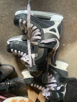 Two pairs of hockey skates