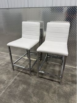 2 leather stools $80