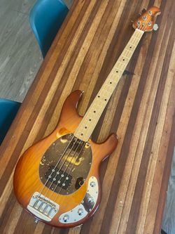 Musicman stingray bass guitar made in America four string 3QH honey burst in excellent condition. Made in 2007. Comes with the original hardshell case