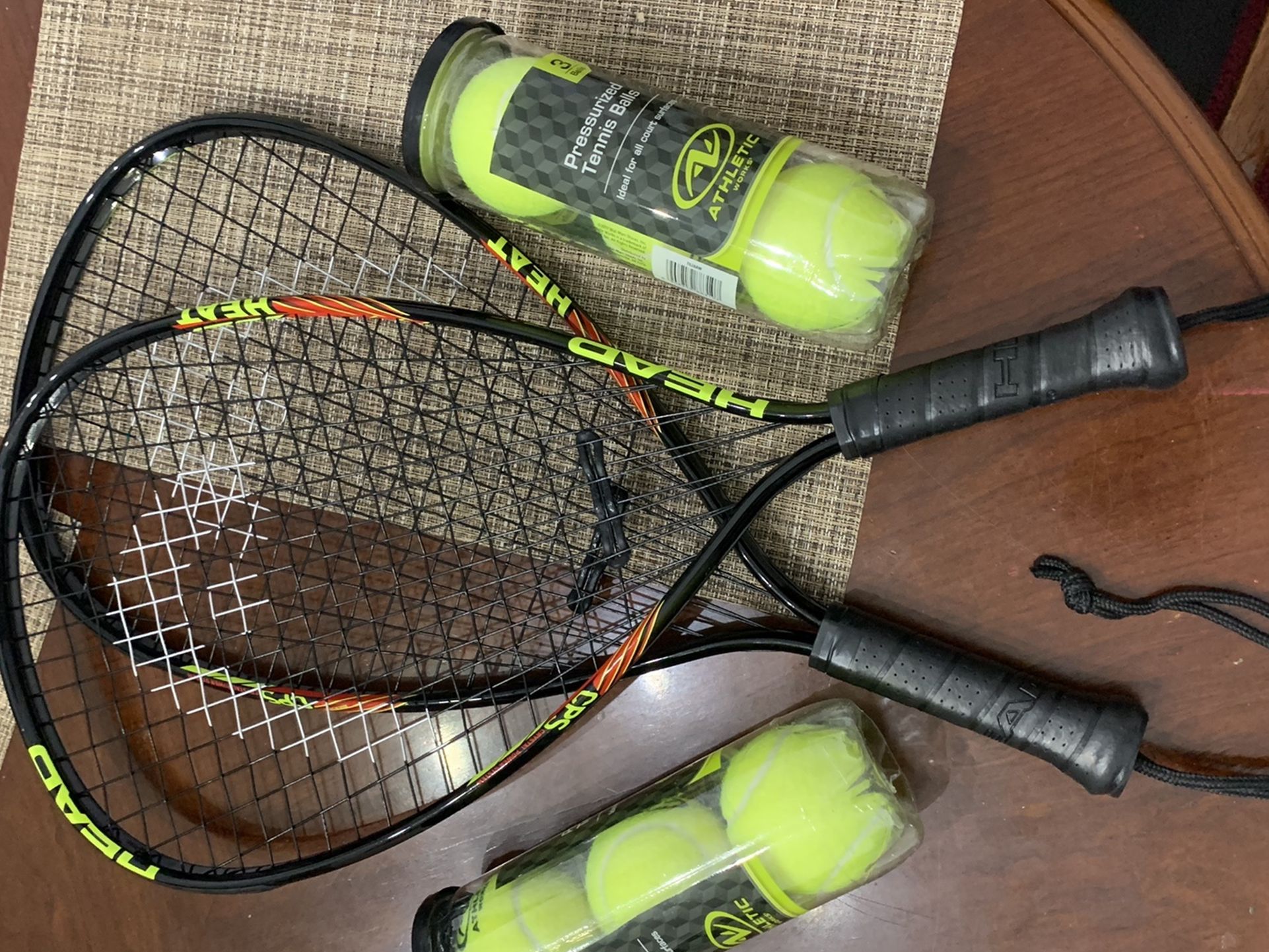 Head tennis rackets and balls