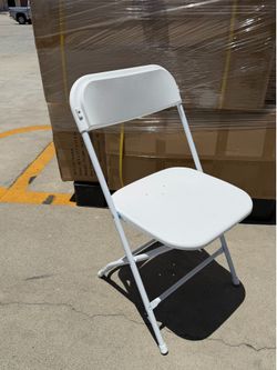 Box of 10 brand-new heavy-duty folding chairs in original packaging.