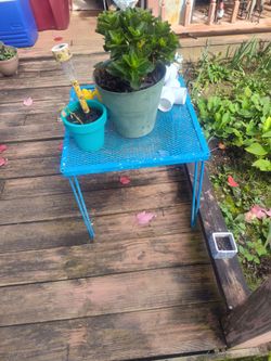 Blue metal table for plants or side table