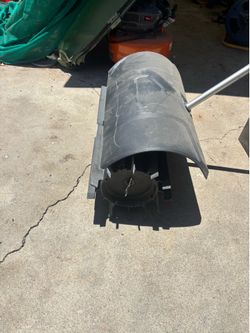 Milwaukee rubber broom / power sweeper attachment for the Milwaukee M18 FUEL QUIK-LOK system.