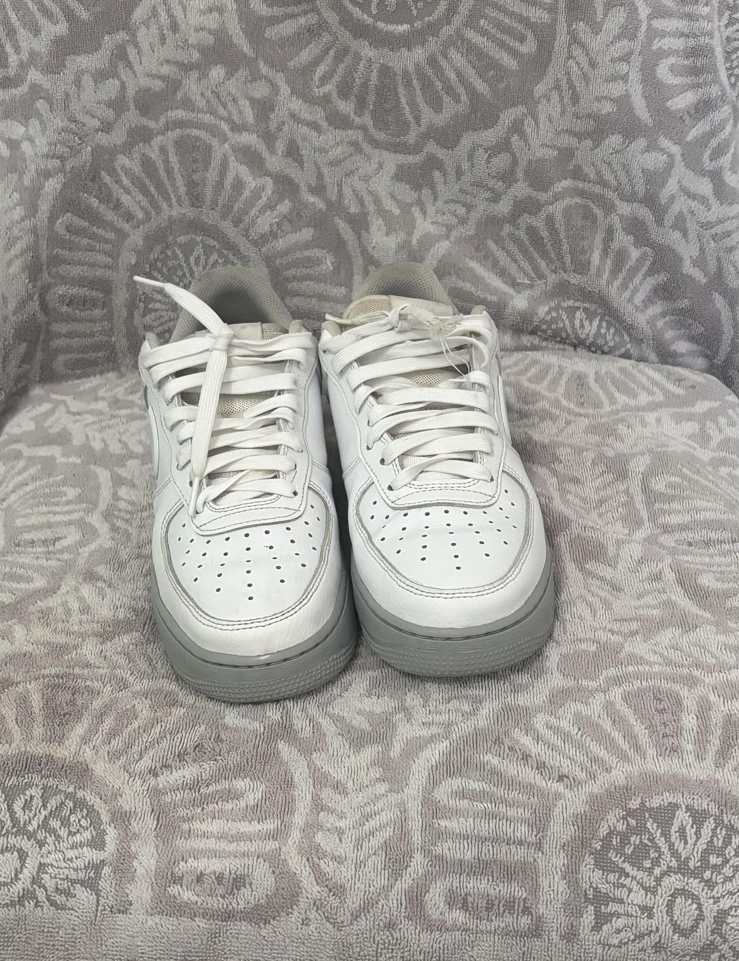 White and grey Nike Air Force 1 trainers