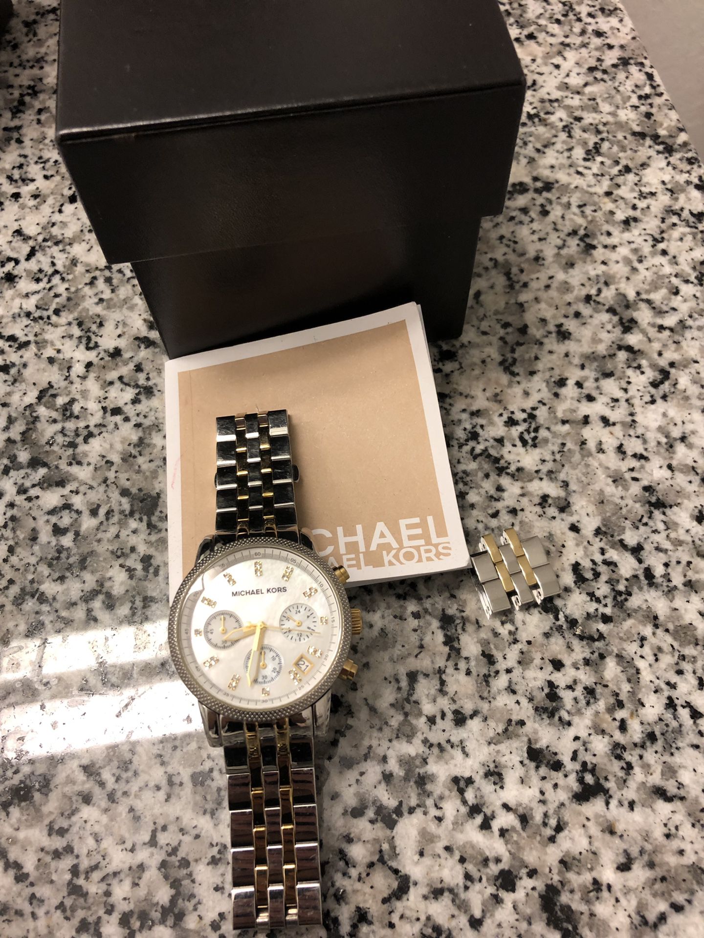 Michael Kors watch. Great condition. Battery needs to be changed. Extra links included. Original price $250. Michael Kors Women's Ritz two tone(gold,