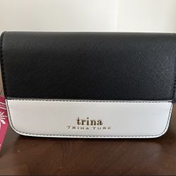 This is a Trina By Trina Turk Small Colorblock Vegan Leather Crossbody Bag in black and white