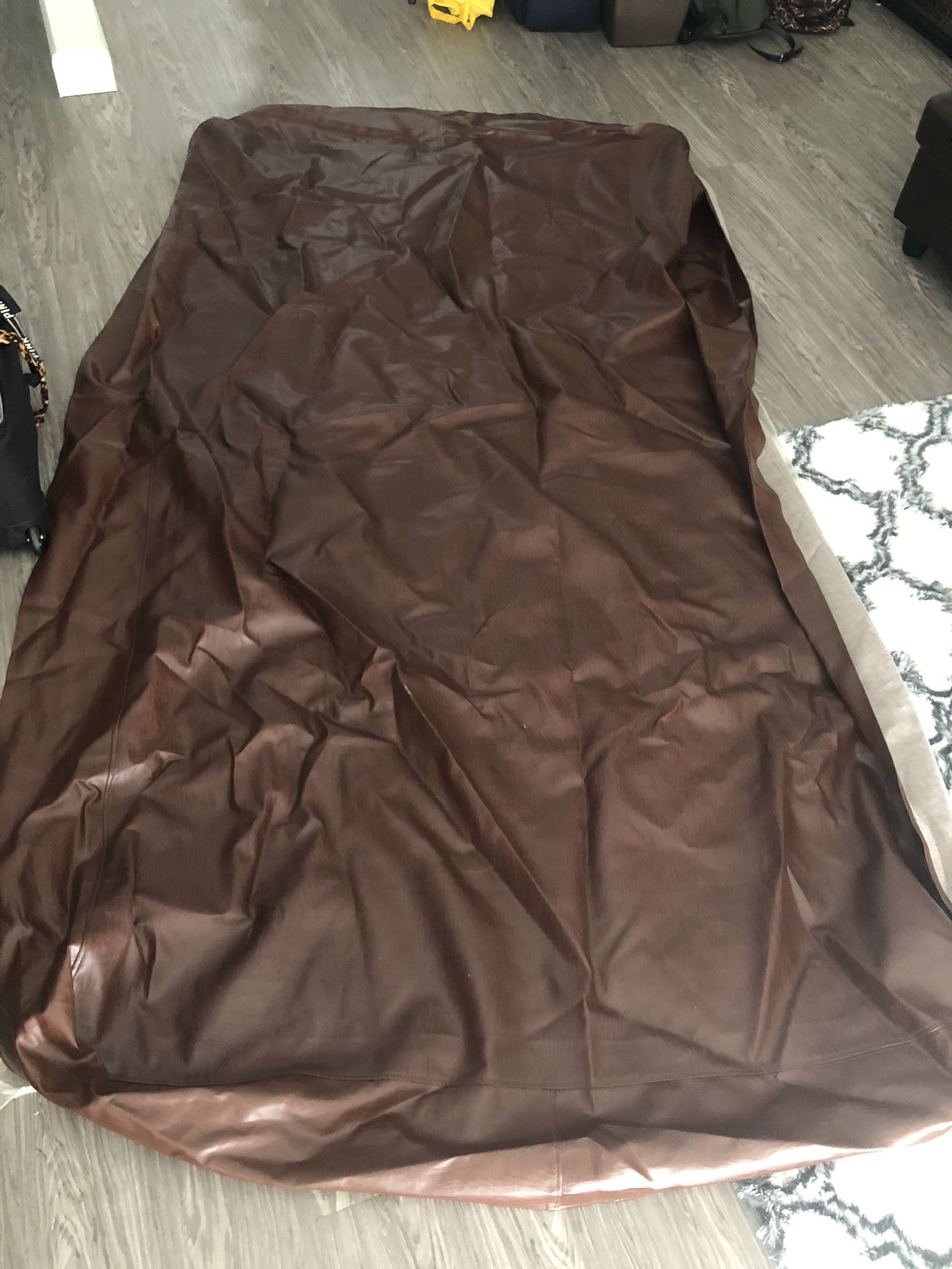 Brown two layered weighted pool table cover