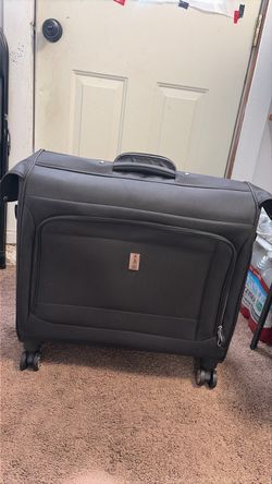 Delsey Garment bag with wheels.