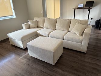 Brand new cream sectional with free ottoman