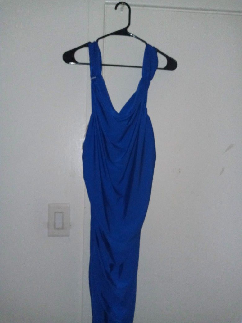 Women's dress. Size 4x. Long And Spandex Type. $15. New.  To Dress Up For Any Special Occasion. Bought For Church Function But Never Got To Wear It. 