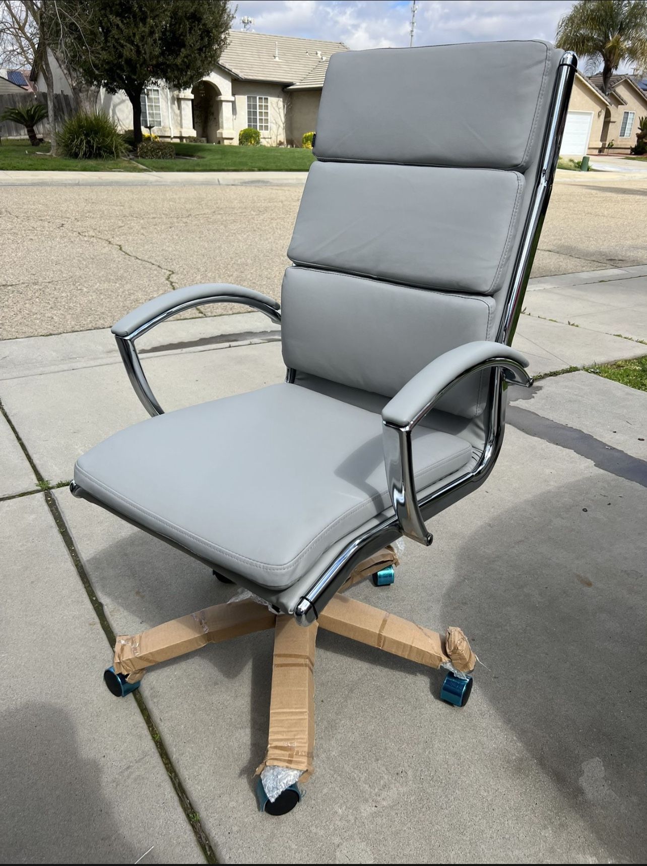 Brand New. Light Grey/chrome High Back Executive Office Chair. Retails Around $400.