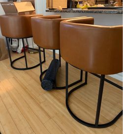 Three leather bar stools