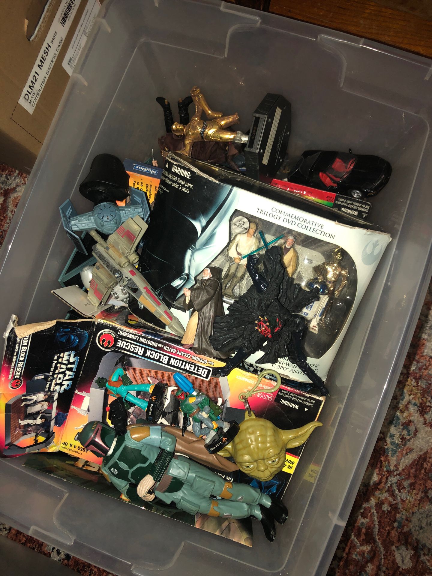 Box of old Star Wars figures and toys