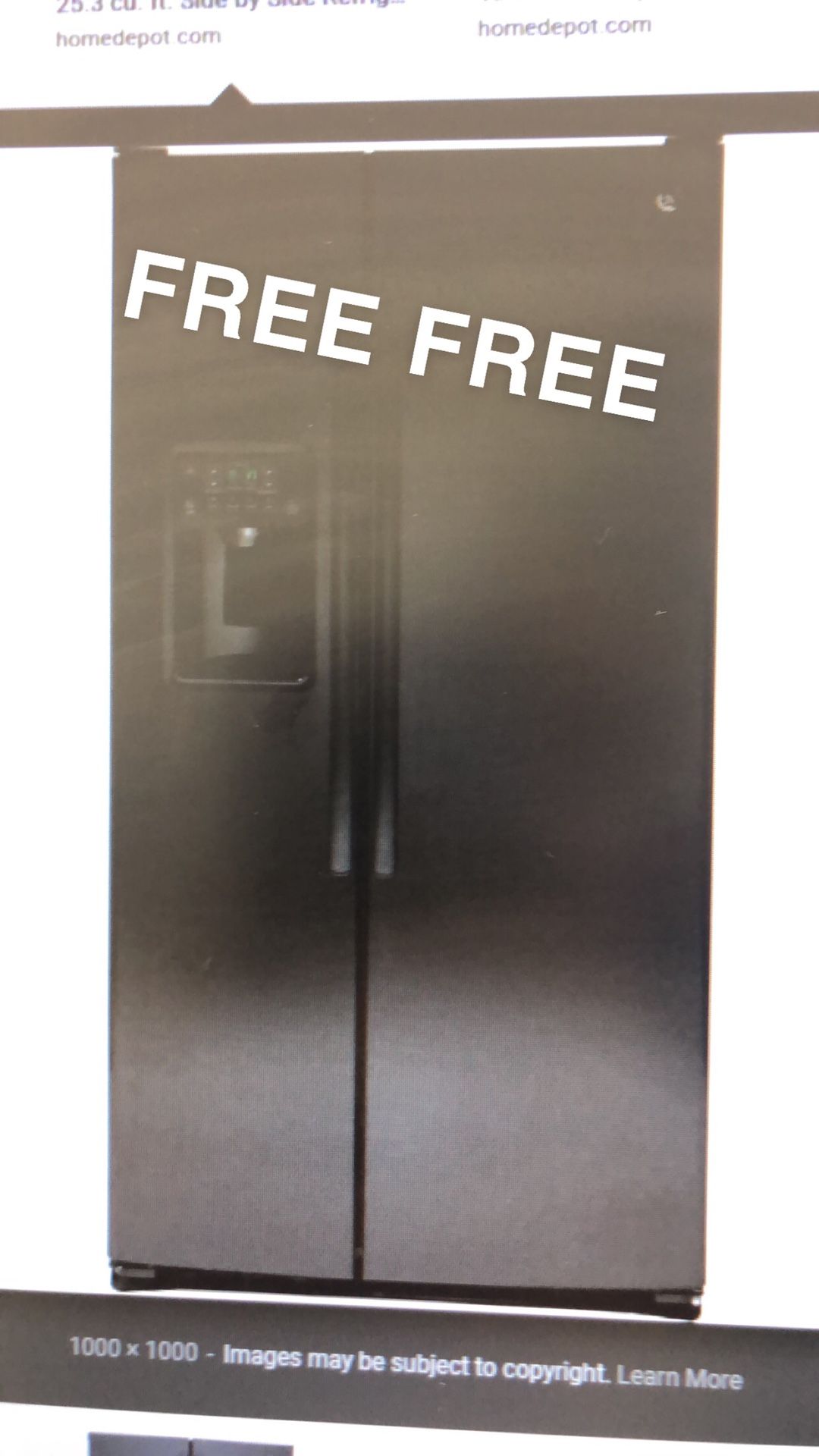 Black GE refrigerator not working *stock photo*
